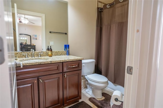 bathroom featuring vanity, tile patterned flooring, ceiling fan, toilet, and walk in shower