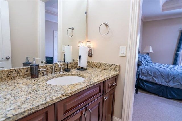 bathroom with vanity and ornamental molding