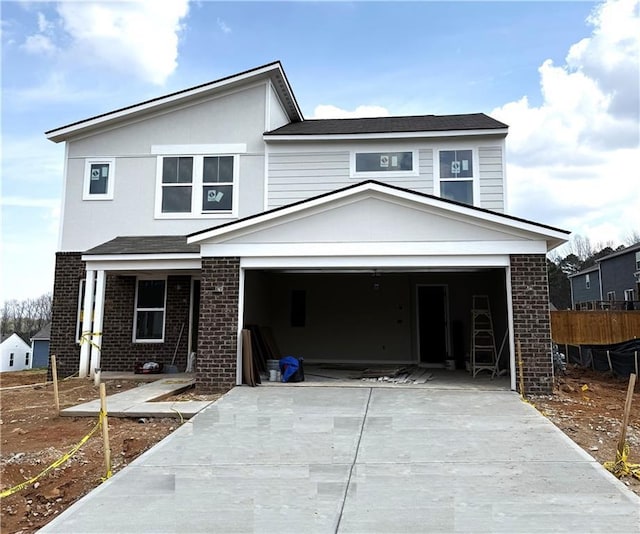 traditional-style house featuring brick siding and driveway