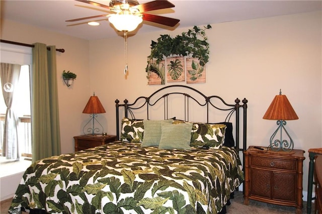 bedroom featuring carpet, multiple windows, and ceiling fan