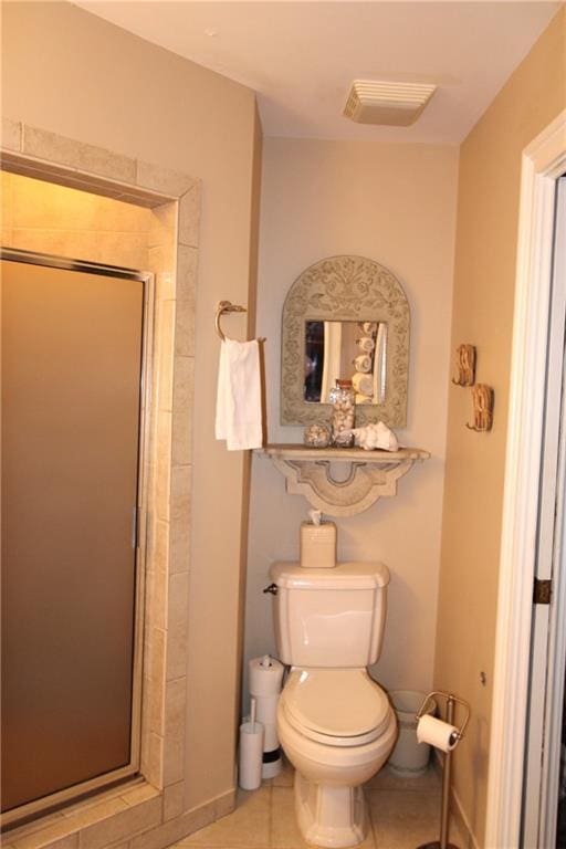 bathroom with visible vents, a shower stall, toilet, and tile patterned floors