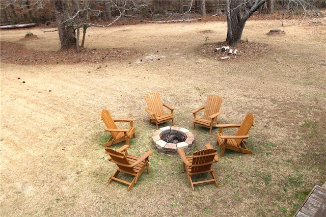 view of yard with an outdoor fire pit