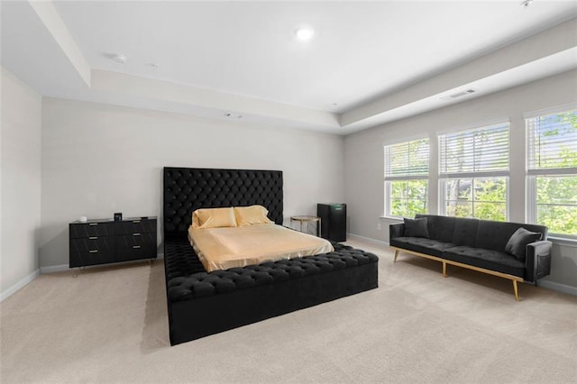 bedroom with baseboards, multiple windows, visible vents, and carpet
