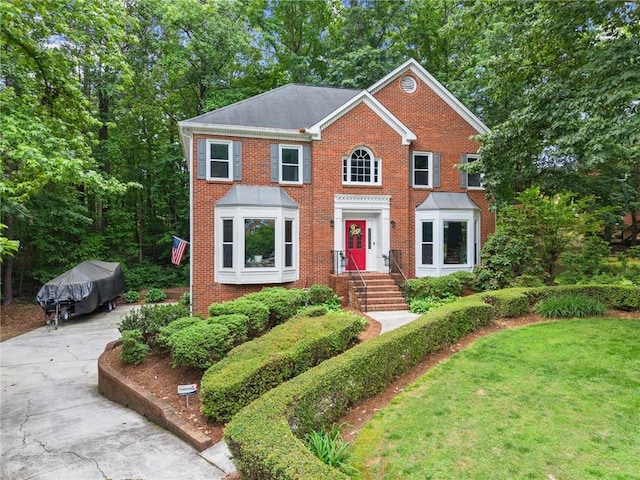1172 Malvern Hunt Ct, Lawrenceville, GA 30043 - view of front of property featuring brick siding, concrete driveway, and a front lawn