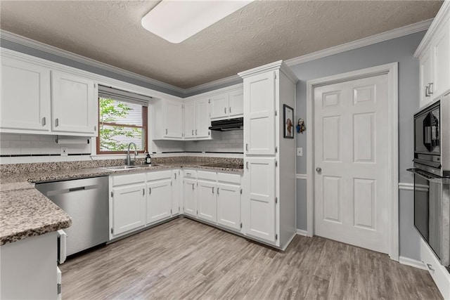 1172 Malvern Hunt Ct, Lawrenceville, GA 30043 - kitchen with black appliances, a sink, under cabinet range hood, white cabinetry, and light wood finished floors