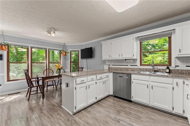 1172 Malvern Hunt Ct, Lawrenceville, GA 30043 - kitchen with dishwasher, a sink, a peninsula, crown molding, and white cabinets