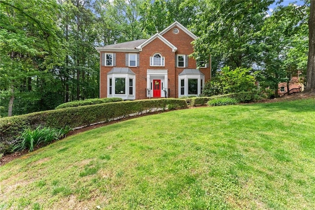 1172 Malvern Hunt Ct, Lawrenceville, GA 30043 - colonial inspired home featuring a front lawn and brick siding