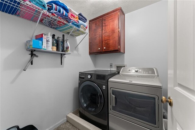 1172 Malvern Hunt Ct, Lawrenceville, GA 30043 - laundry area featuring separate washer and dryer, cabinet space, and baseboards