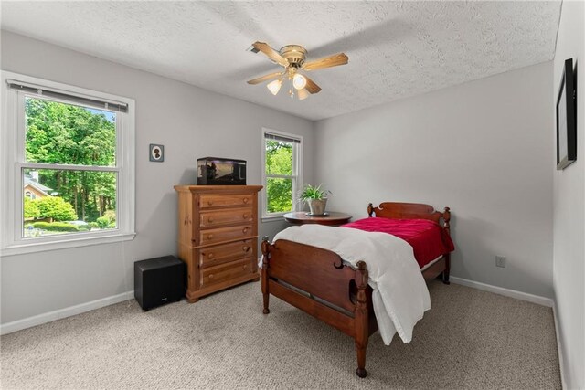 1172 Malvern Hunt Ct, Lawrenceville, GA 30043 - bedroom with carpet flooring, a textured ceiling, baseboards, and a ceiling fan