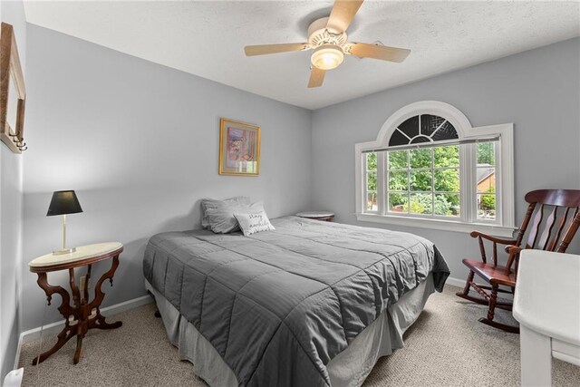 1172 Malvern Hunt Ct, Lawrenceville, GA 30043 - carpeted bedroom featuring baseboards and ceiling fan