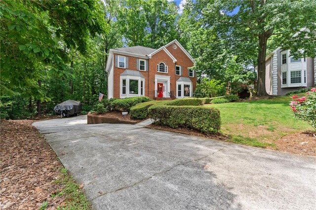 1172 Malvern Hunt Ct, Lawrenceville, GA 30043 - view of front of property with brick siding and a front yard