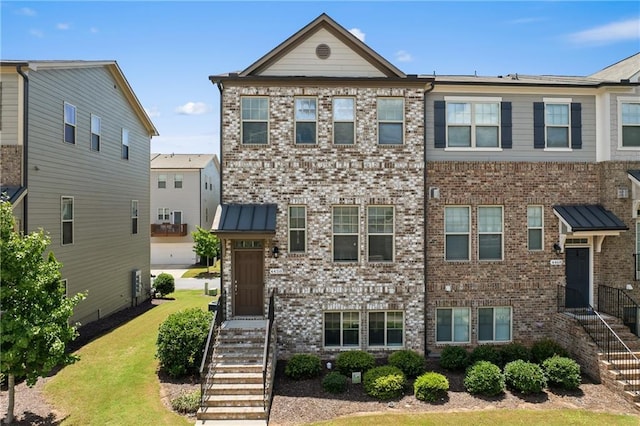 4458 Dunblane Ave, Sugar Hill, GA 30518 - townhome / multi-family property with brick siding and a front lawn