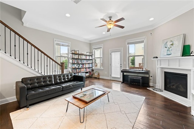 4458 Dunblane Ave, Sugar Hill, GA 30518 - living area with crown molding, ceiling fan, hardwood / wood-style floors, a glass covered fireplace, and recessed lighting