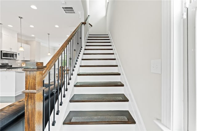 4458 Dunblane Ave, Sugar Hill, GA 30518 - staircase featuring recessed lighting and crown molding