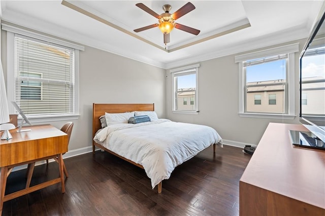4458 Dunblane Ave, Sugar Hill, GA 30518 - bedroom featuring a raised ceiling, crown molding, dark wood-type flooring, an office area, and a ceiling fan