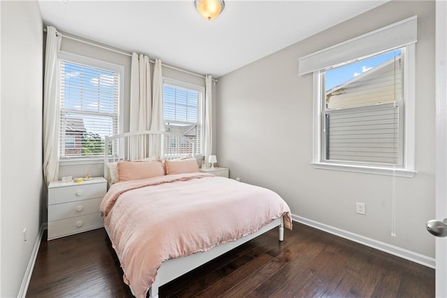 4458 Dunblane Ave, Sugar Hill, GA 30518 - bedroom with dark wood-style flooring and multiple windows