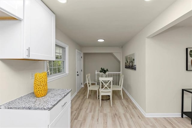 dining room with light hardwood / wood-style floors