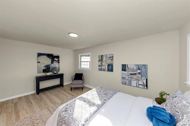 bedroom with hardwood / wood-style floors