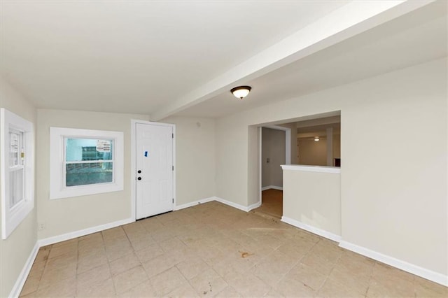 interior space featuring beam ceiling