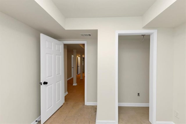 unfurnished bedroom featuring a closet and light tile patterned flooring