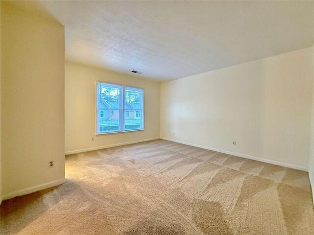 3533 Mulberry Way, Duluth, GA 30096 - empty room featuring light carpet and baseboards