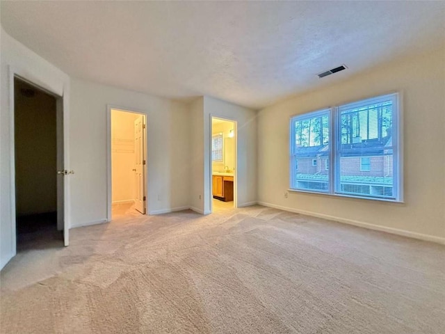 3533 Mulberry Way, Duluth, GA 30096 - unfurnished bedroom featuring light carpet, connected bathroom, and a spacious closet