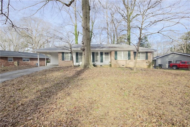 ranch-style house with a carport