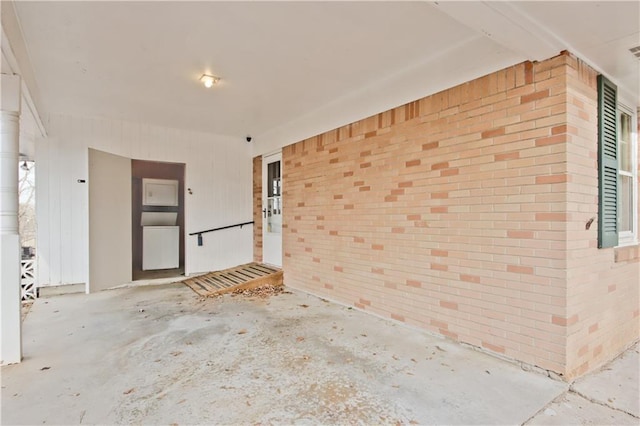 spare room with brick wall