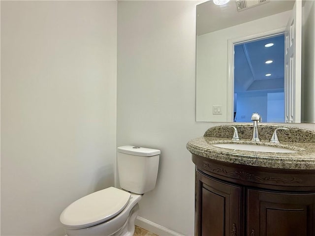 6765 Crofton Dr, Alpharetta, GA 30005 - half bath with baseboards, toilet, and vanity