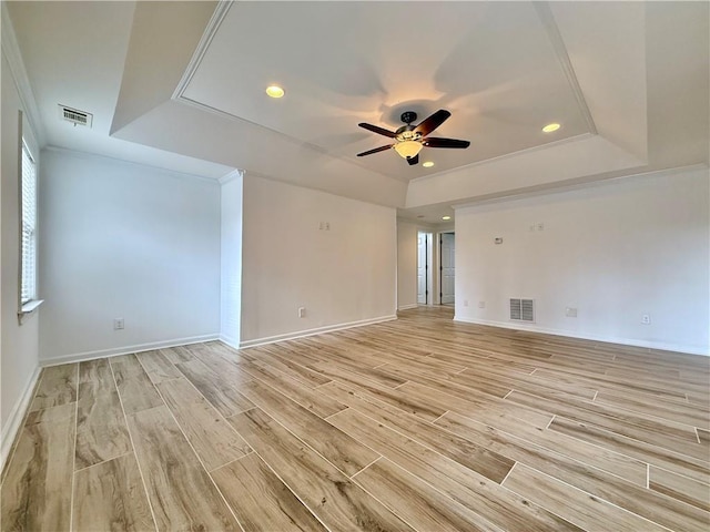 6765 Crofton Dr, Alpharetta, GA 30005 - spare room with a tray ceiling, ceiling fan, light wood-style flooring, recessed lighting, and baseboards
