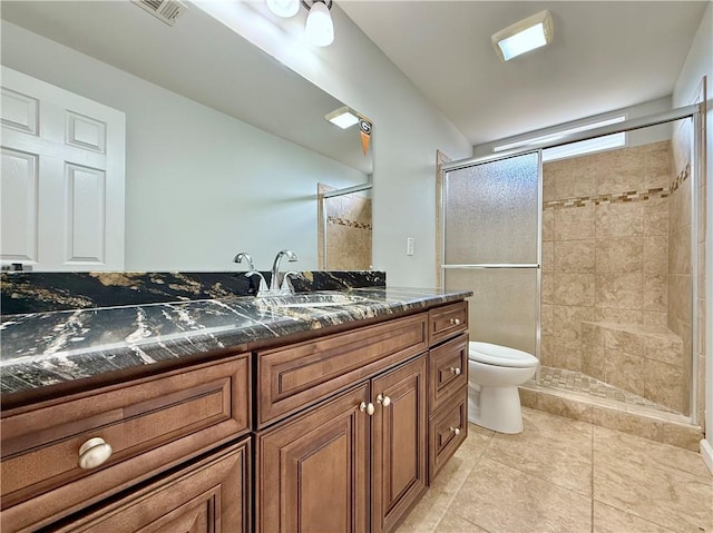 6765 Crofton Dr, Alpharetta, GA 30005 - bathroom with toilet, a stall shower, vanity, and tile patterned flooring