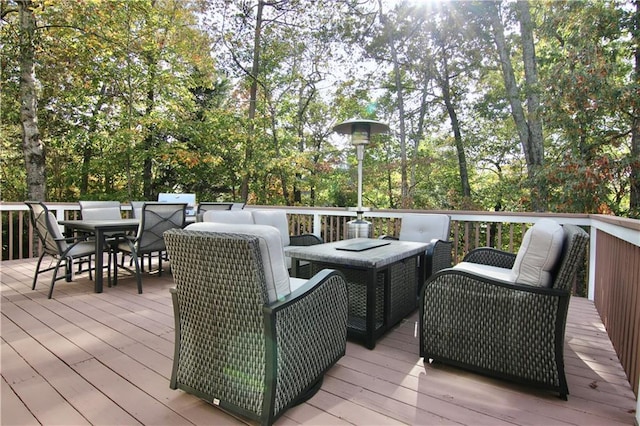 6765 Crofton Dr, Alpharetta, GA 30005 - wooden deck with outdoor dining space, view of wooded area, and an outdoor living space
