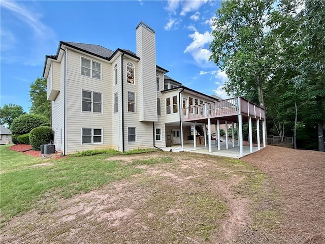 6765 Crofton Dr, Alpharetta, GA 30005 - rear view of house featuring a patio area, a chimney, central AC unit, a wooden deck, and a yard