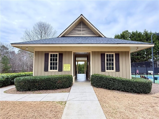 6765 Crofton Dr, Alpharetta, GA 30005 - view of front of property with a shingled roof, board and batten siding, and fence