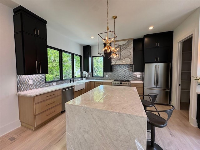 3960 Clairmont Rd Unit 2, Chamblee, GA 30341 - kitchen with appliances with stainless steel finishes, dark cabinets, light countertops, a sink, and tasteful backsplash