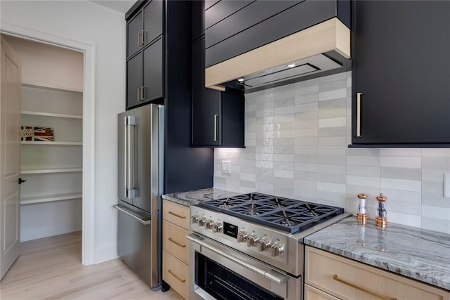 3960 Clairmont Rd Unit 2, Chamblee, GA 30341 - kitchen featuring high quality appliances, premium range hood, light brown cabinetry, and dark cabinetry
