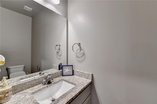 half bath with toilet and vanity
