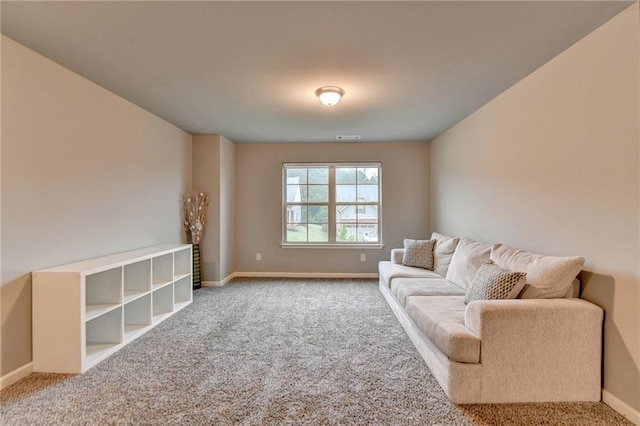 living area featuring carpet floors and baseboards