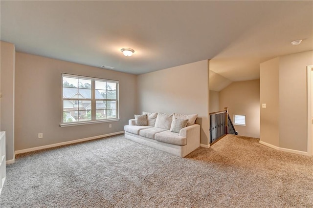 living room featuring carpet flooring and baseboards