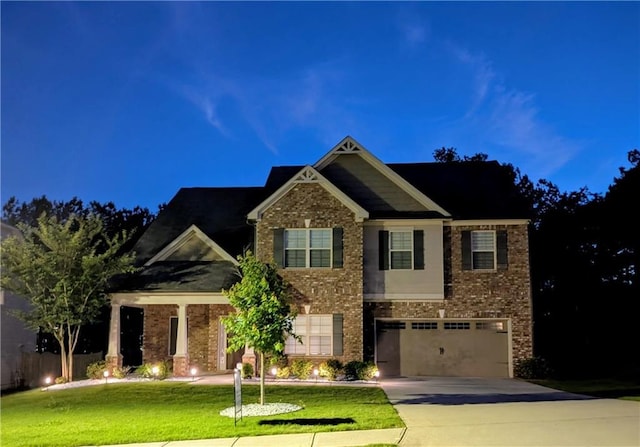 3419 Mulberry Cove Way, Auburn, GA 30011 - craftsman-style house with driveway, brick siding, an attached garage, and a front lawn