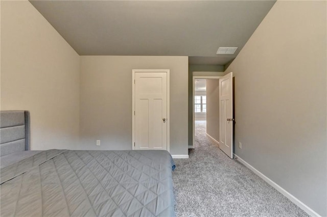 unfurnished bedroom featuring carpet and baseboards
