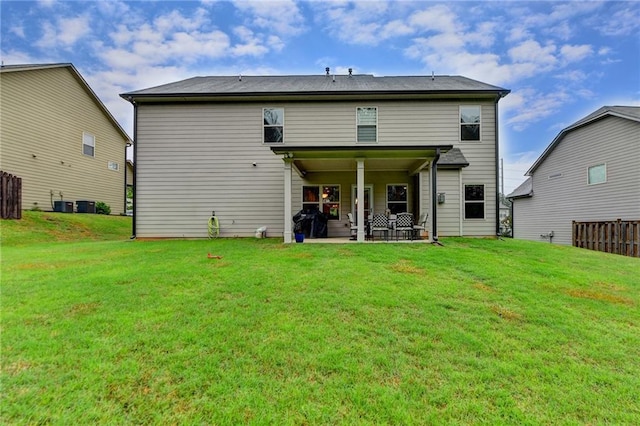 rear view of house with a patio