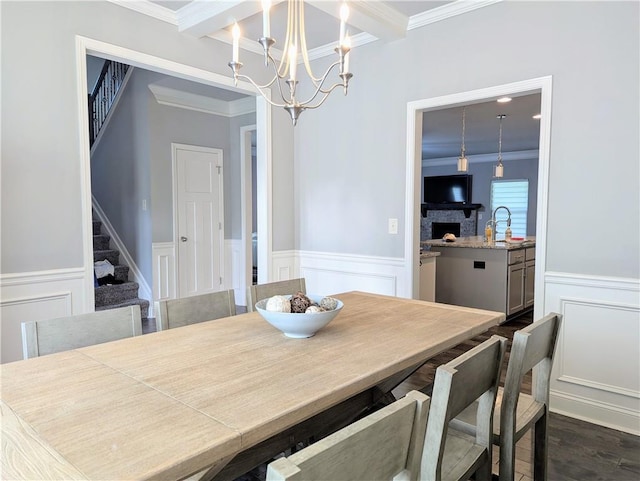 3419 Mulberry Cove Way, Auburn, GA 30011 - dining area featuring a chandelier, ornamental molding, a decorative wall, stairway, and a wainscoted wall