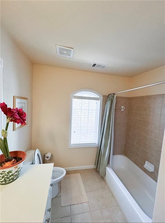 bathroom featuring shower / bath combination with curtain, tile patterned flooring, visible vents, and vanity