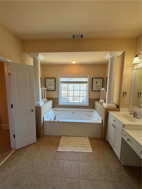 full bath with visible vents, a garden tub, tile patterned flooring, vanity, and ornate columns