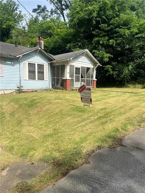 702 Emily Pl Unit 0, Atlanta, GA 30318 - view of grassy yard featuring a sunroom
