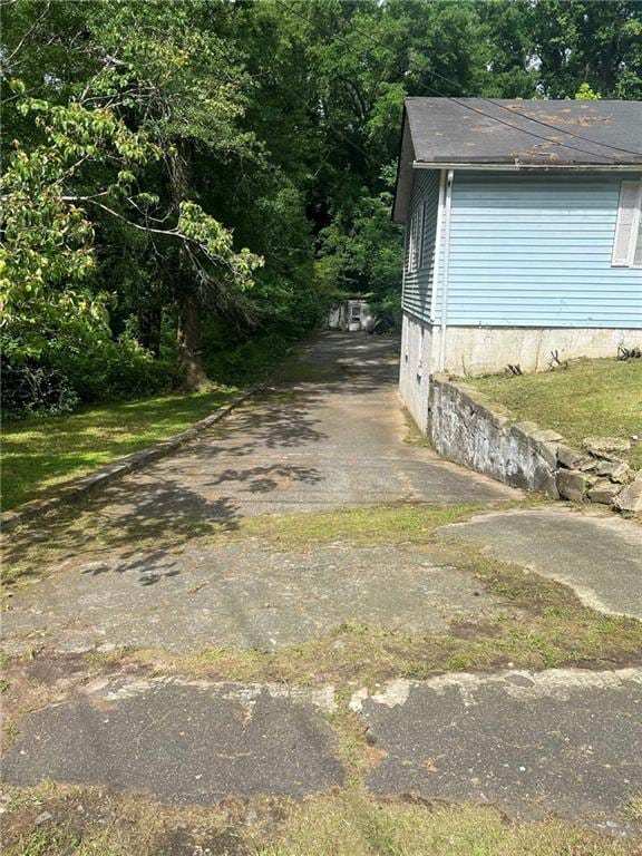 702 Emily Pl Unit 0, Atlanta, GA 30318 - view of side of property featuring asphalt driveway