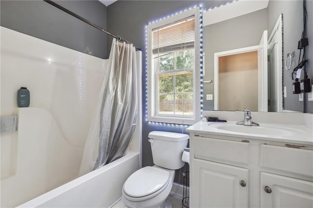 bathroom featuring toilet, vanity, and shower / bathtub combination with curtain