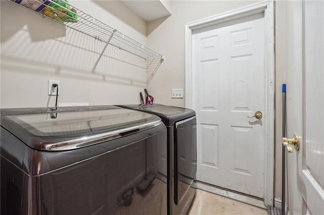clothes washing area with washer and dryer