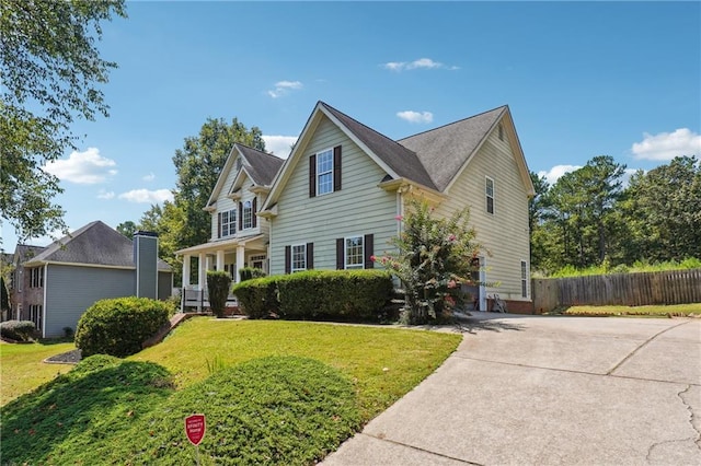 traditional-style home with concrete driveway